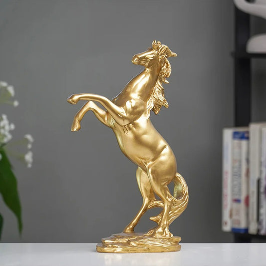 Gold horse statue on a gray background